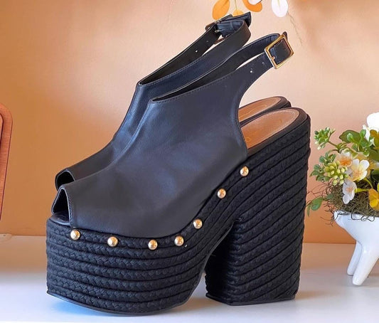 Black woven platform heels with gold details